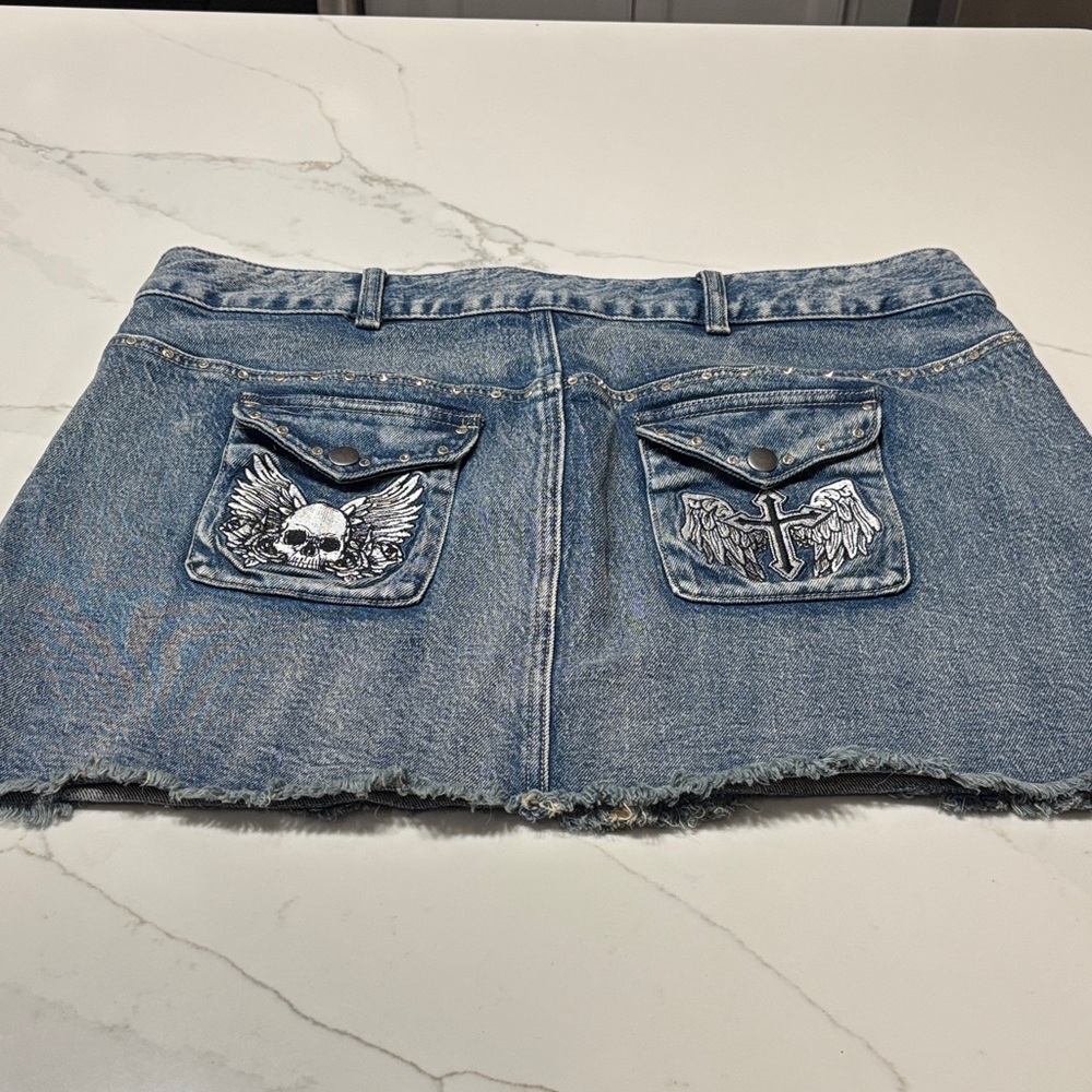 Edgy Blue Denim Mini Skirt with Skull and Cross Design